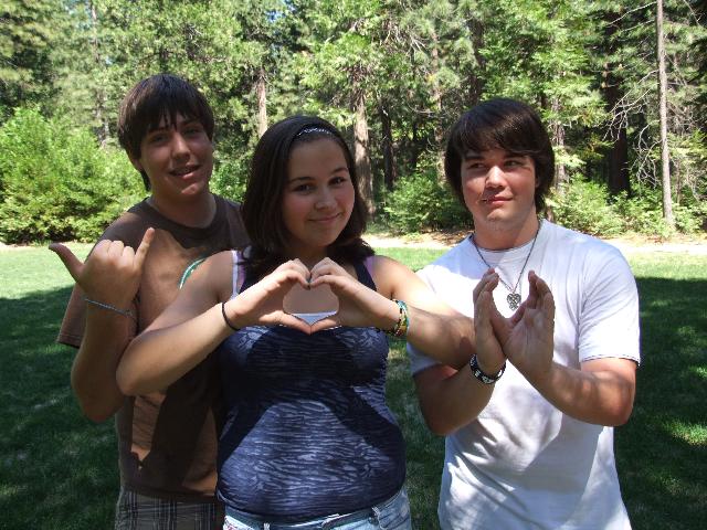 Camper making heart shape with hands