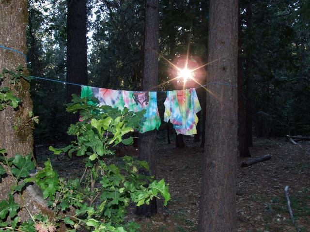 Tie-dye shirts hanging on a clothesline
